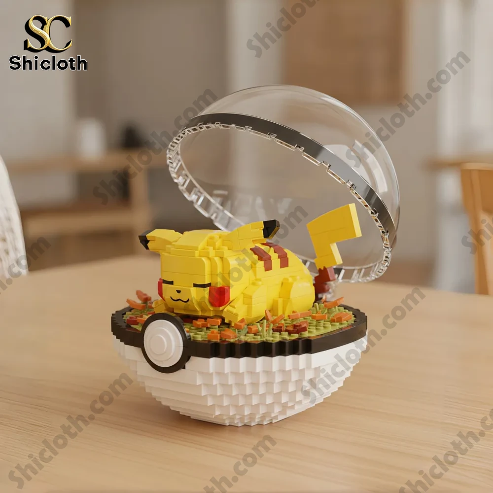 Sleeping Pikachu brick figure inside a Pokeball display on a wooden table!
