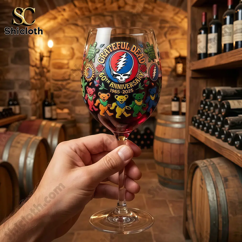 Hand holding Grateful Dead anniversary wine glass in wine cellar!