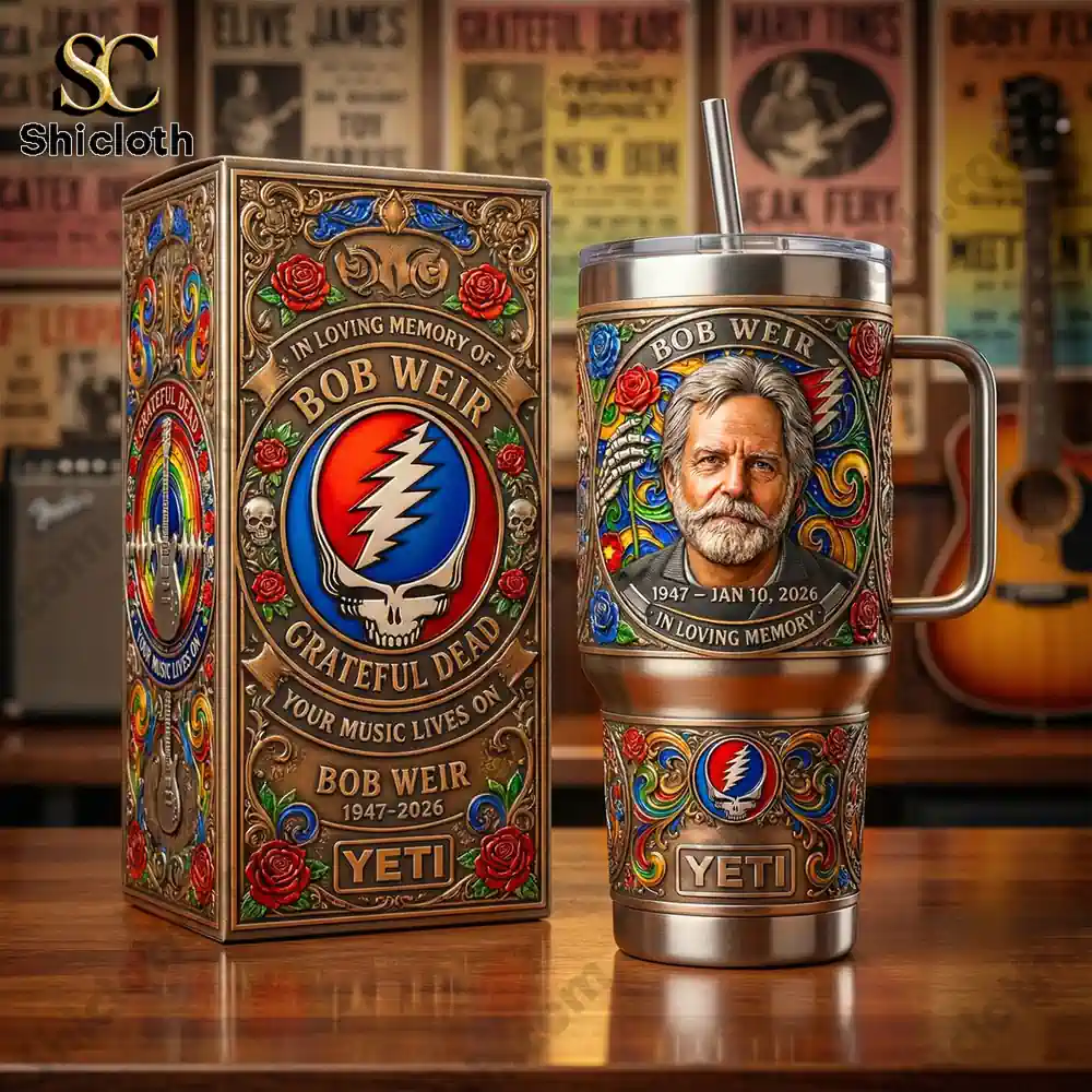 Grateful Dead Bob Weir memorial tumbler and box displayed on wooden table.
