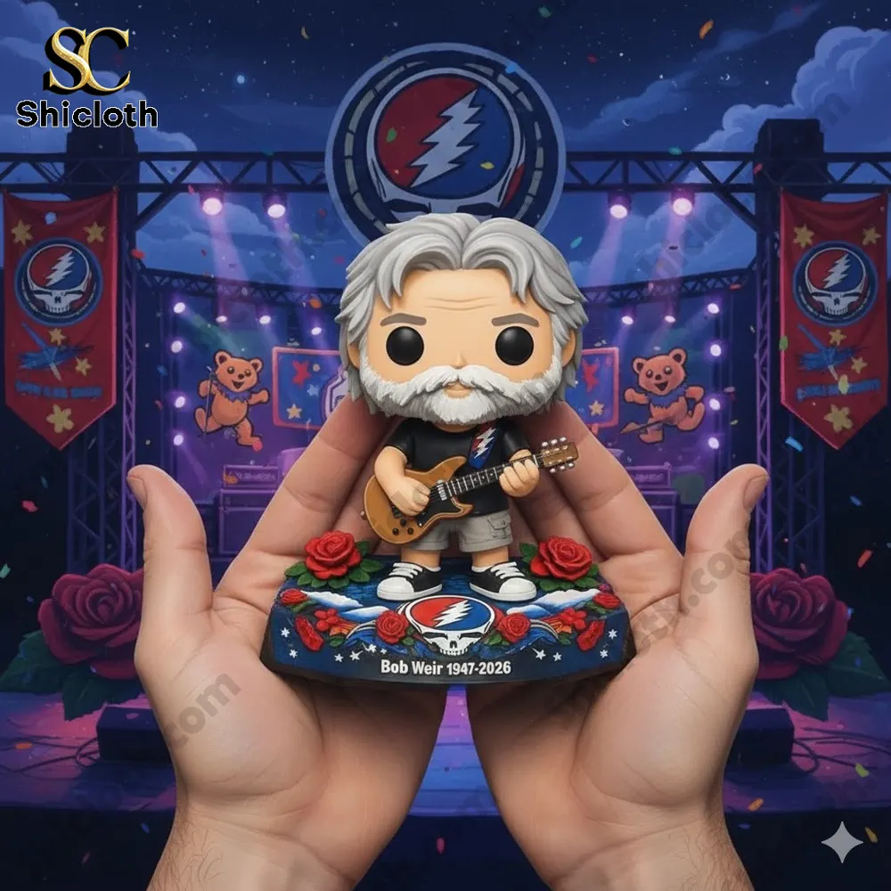 Bob Weir memorial style collectible figure holding a guitar on a concert stage!
