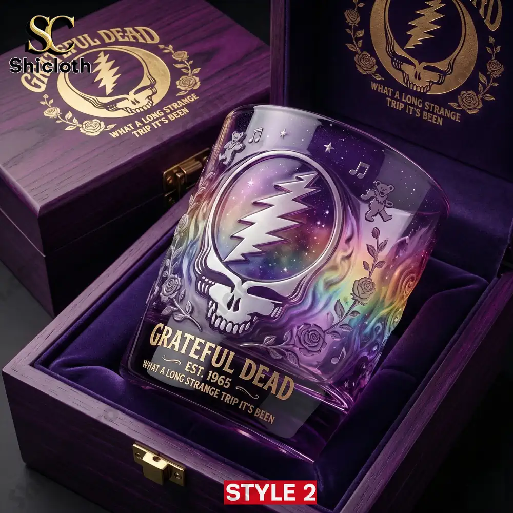 Grateful Dead skull glass with colorful cosmic design in purple wooden box.