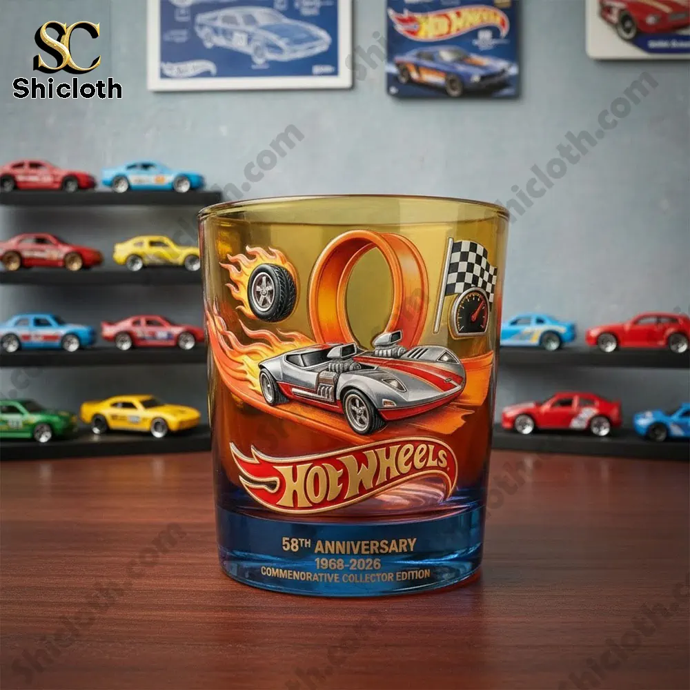 Hot Wheels themed whiskey glass displayed on a desk with model cars!