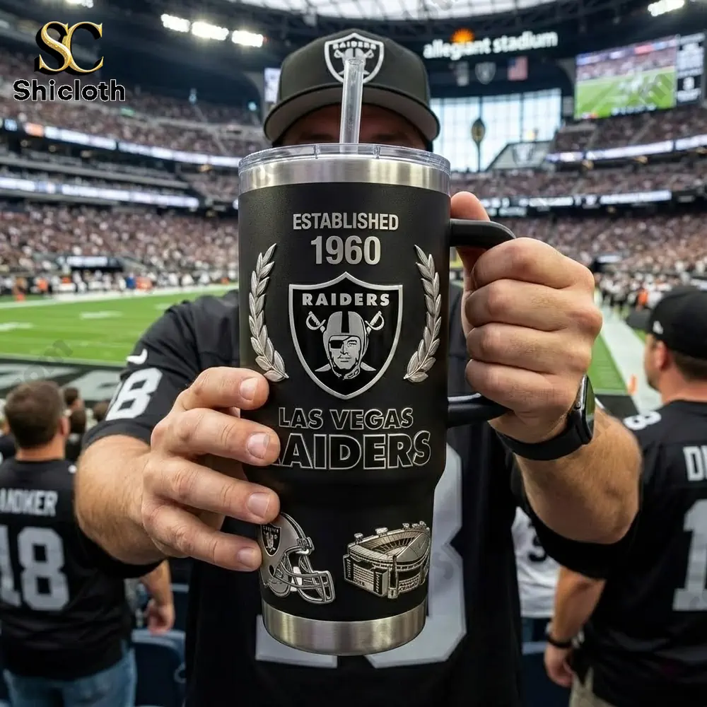Fan holding Las Vegas Raiders insulated tumbler inside stadium!
