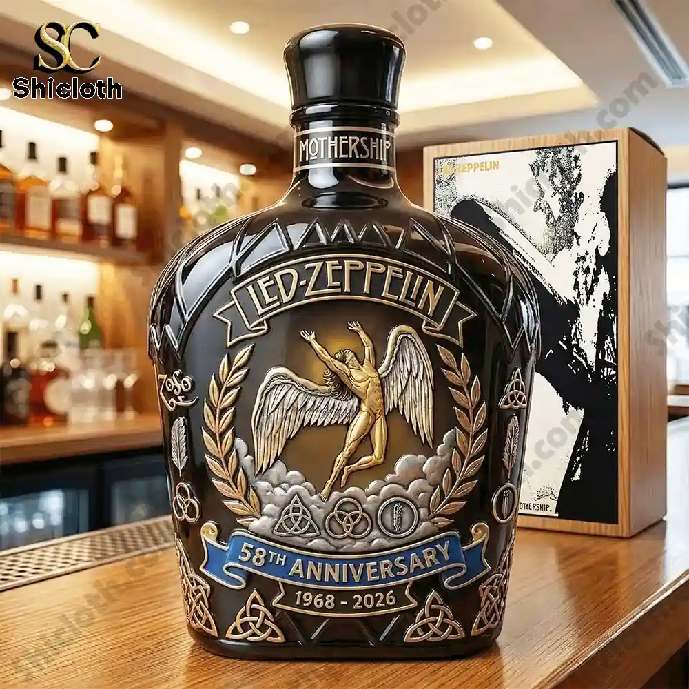 Close up of Led Zeppelin anniversary whiskey bottle on wooden bar counter.