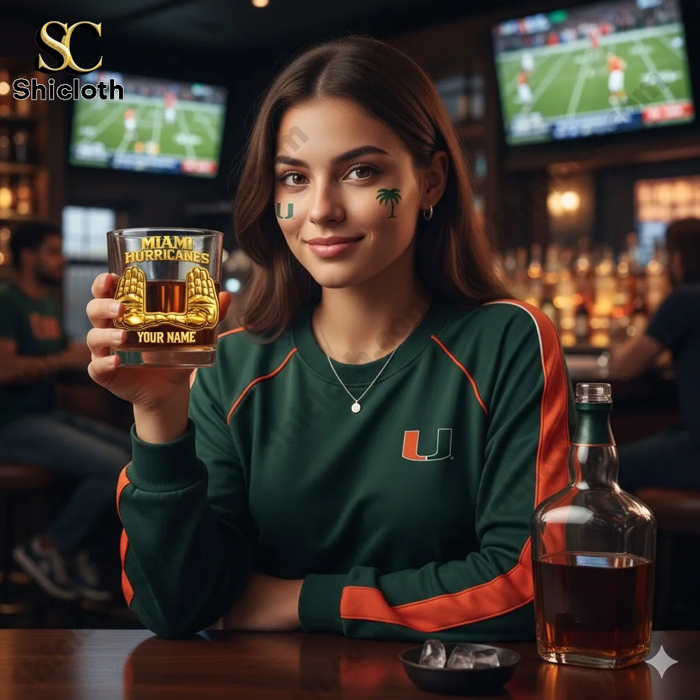 Woman holding a personalized Miami Hurricanes whiskey glass in a sports bar!
