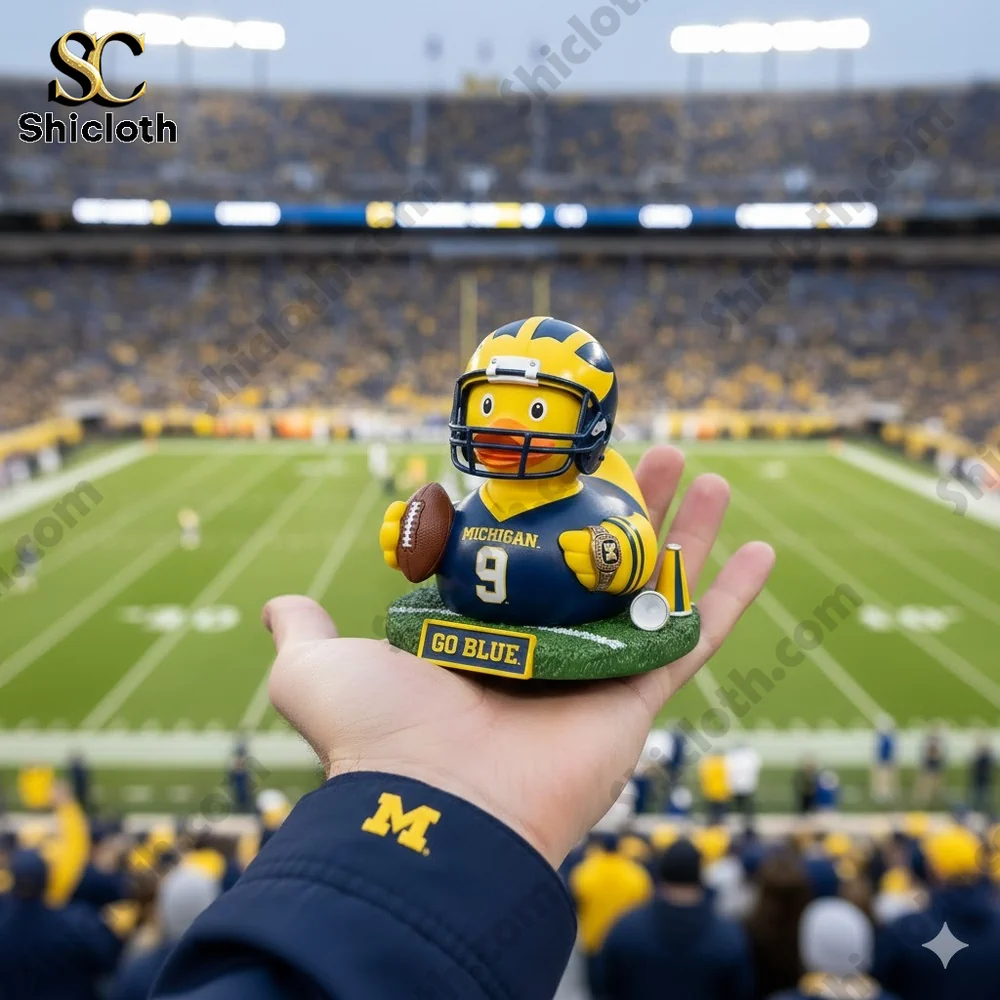 Dolly Parton's 80th Anniversary 1946-2026 Collectible Pop Figure Doll 80 Michigan Wolverines rubber duck football figure held in hand at stadium background!