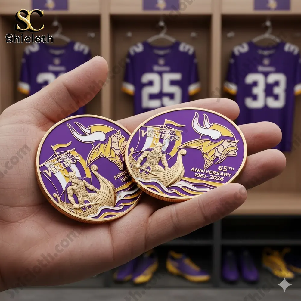 Vikings anniversary coin held in hand inside locker room!