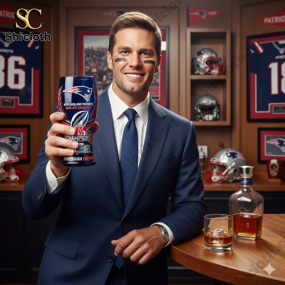 Man in suit holding New England Patriots champions beer glass in themed bar setting!