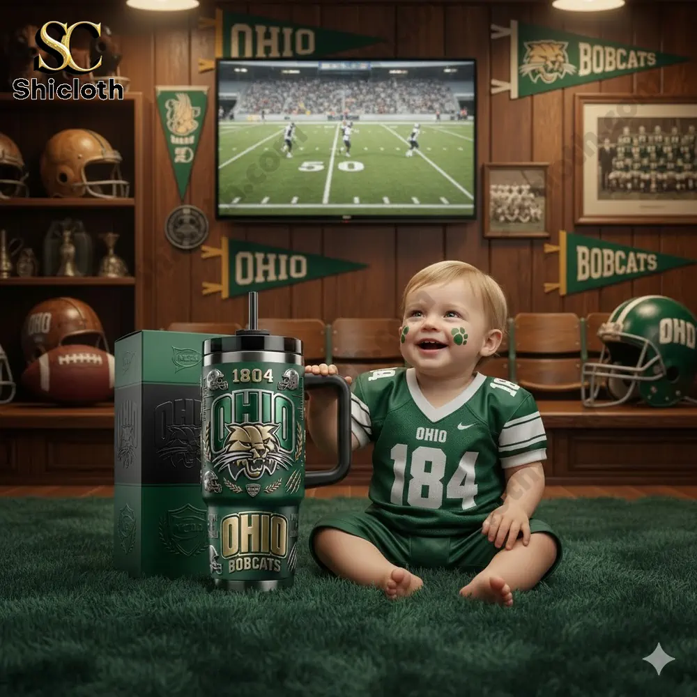 Baby with Ohio Bobcats tumbler in sports themed room!