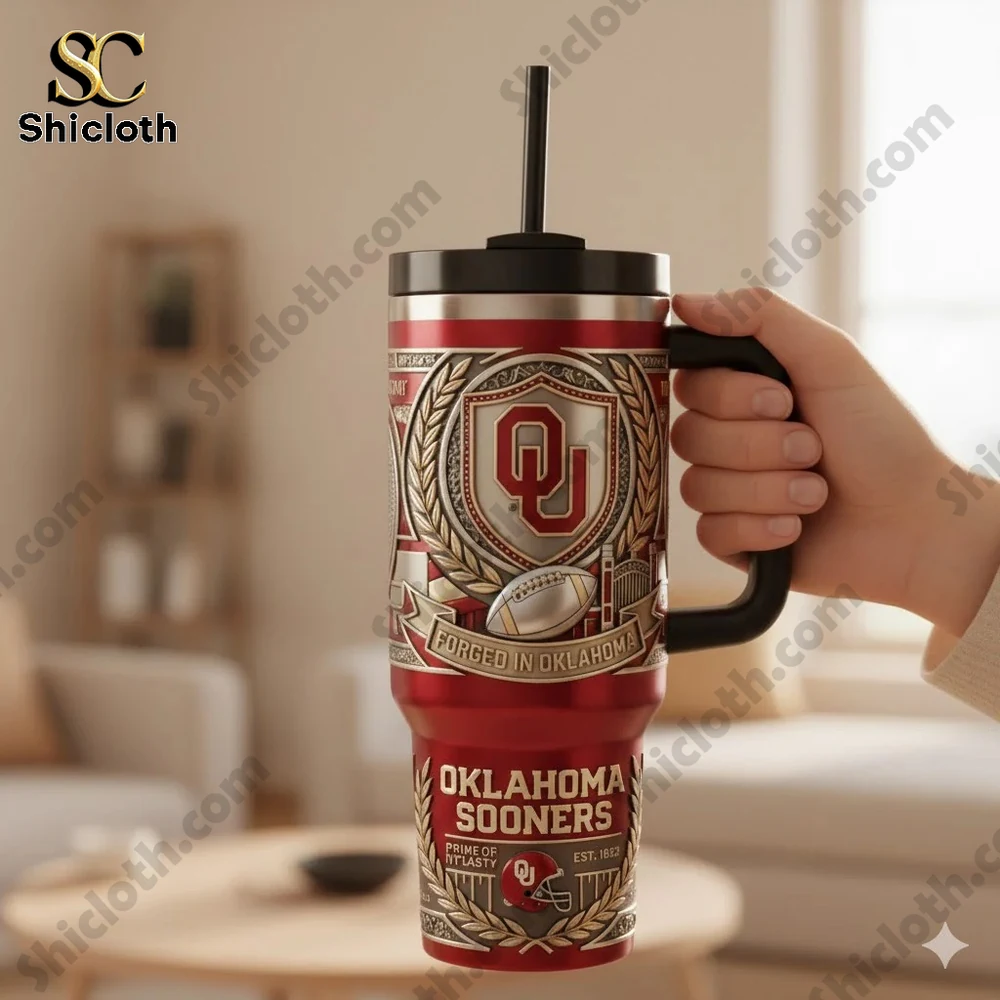 Oklahoma Sooners Crimson Dynasty Forged In Oklahoma Tumbler With Handle 3 Oklahoma Sooners tumbler displayed with gift box on table!