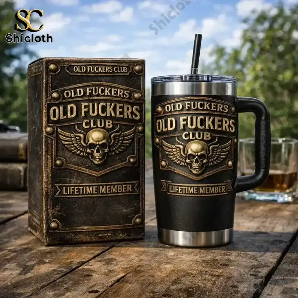 Old Fuckers Club insulated mug with gift box on a wooden outdoor table!