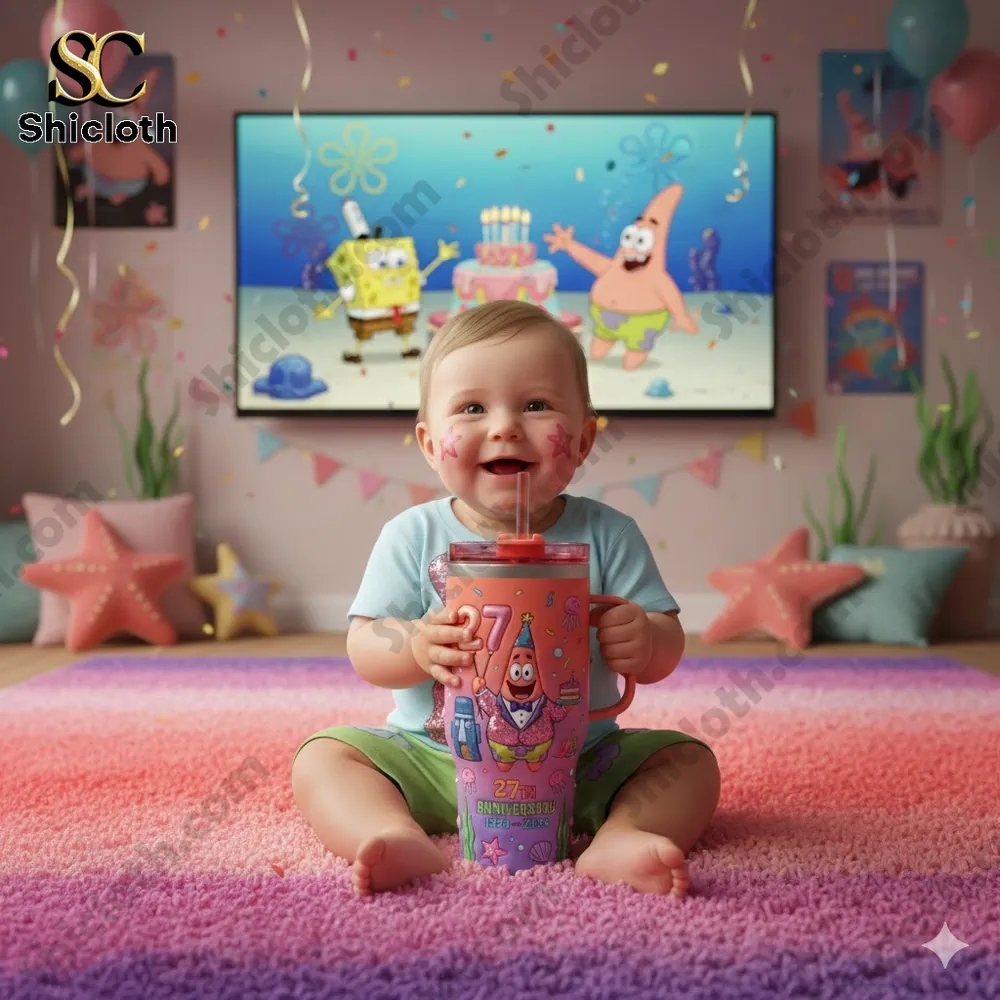 Smiling baby holding Patrick Star themed tumbler in a cartoon birthday room!