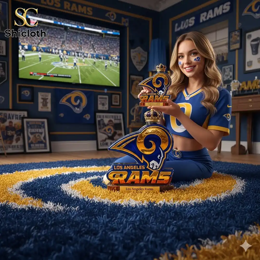 Los Angeles Rams fan holding a Rams anniversary display in a themed room!