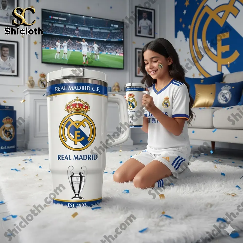 Young Real Madrid fan holding branded insulated mug in themed room!