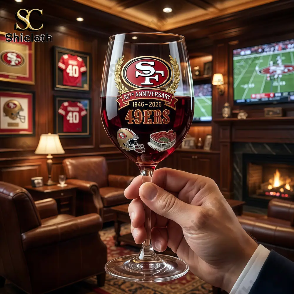 San Francisco 49ers anniversary wine glass held in luxury lounge