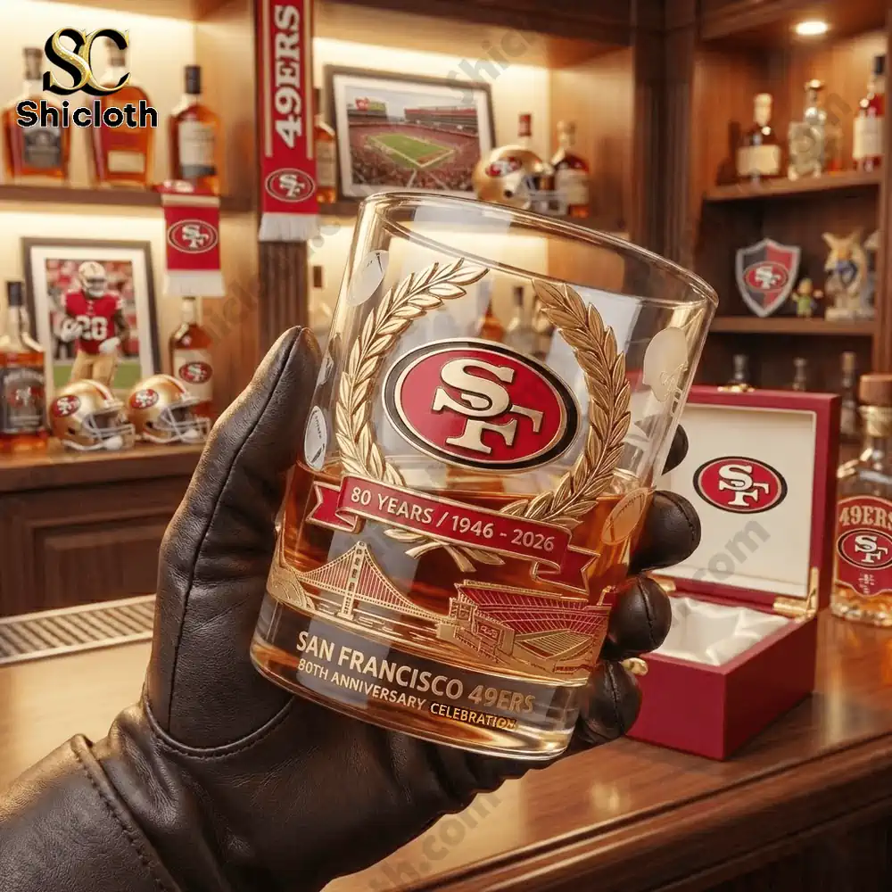 San Francisco Forty Niners anniversary whiskey glass held in a bar!