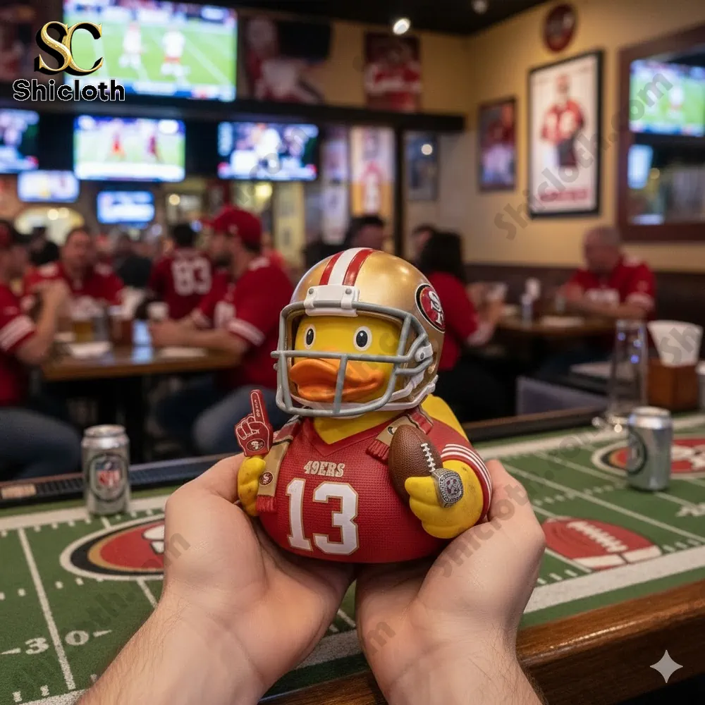 Dolly Parton's 80th Anniversary 1946-2026 Collectible Pop Figure Doll 68 Rubber duck football figure wearing red jersey in sports bar scene!