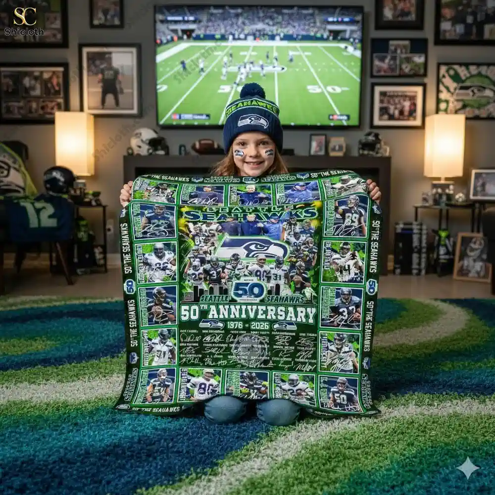 Child holding Seattle Seahawks fiftieth anniversary commemorative blanket from Shicloth!