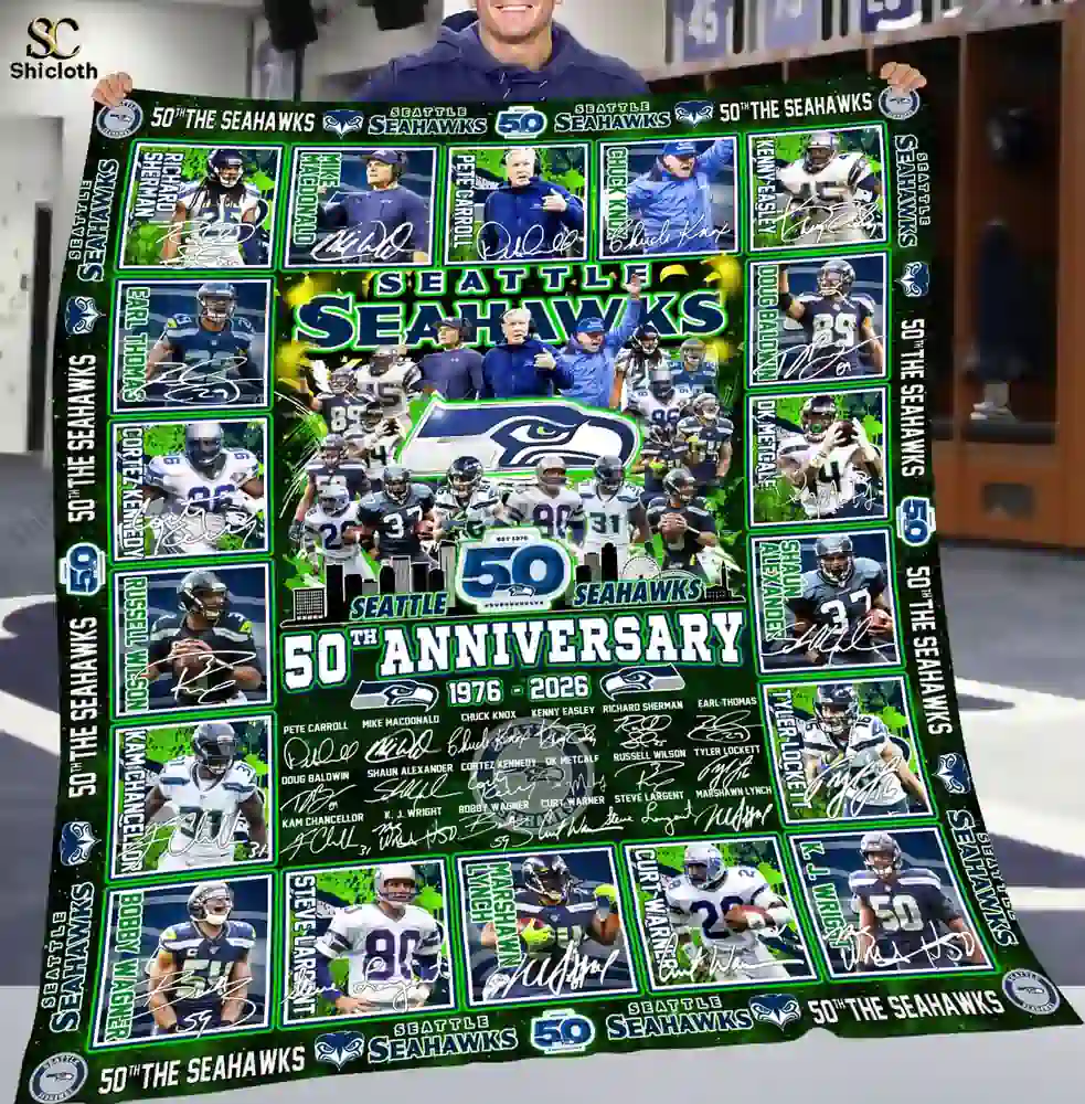 Adult holding Seattle Seahawks fiftieth anniversary commemorative blanket from Shicloth!