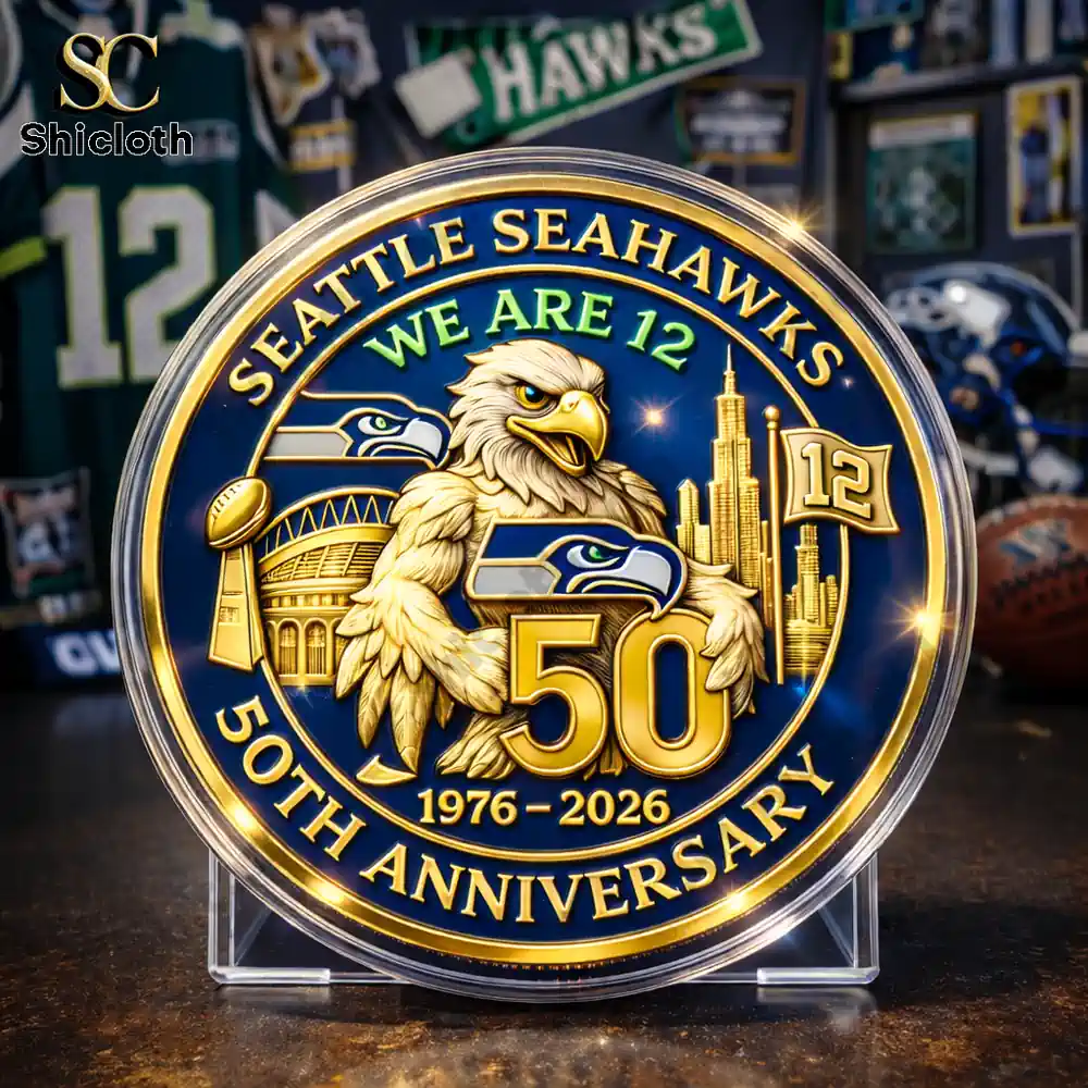 Seattle Seahawks anniversary coin displayed on a stand with detailed gold design!