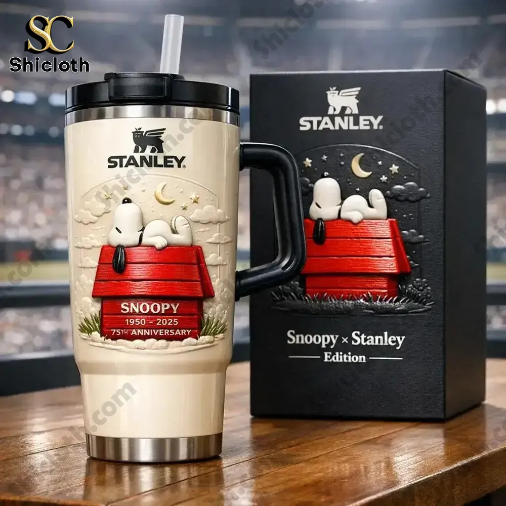 Stanley tumbler with Snoopy resting on red doghouse!