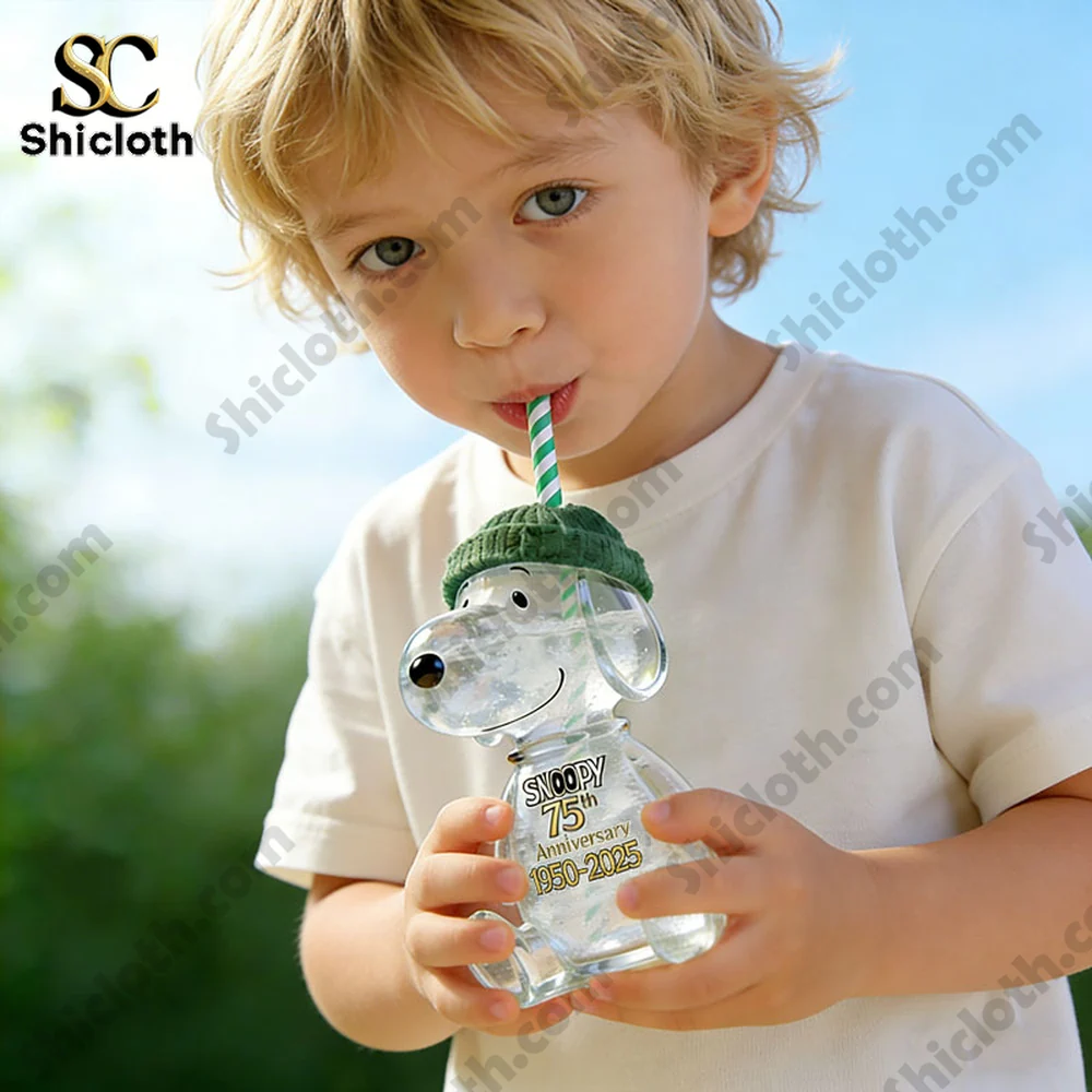 Child holding Snoopy 75 anniversary clear bottle with straw outdoors!