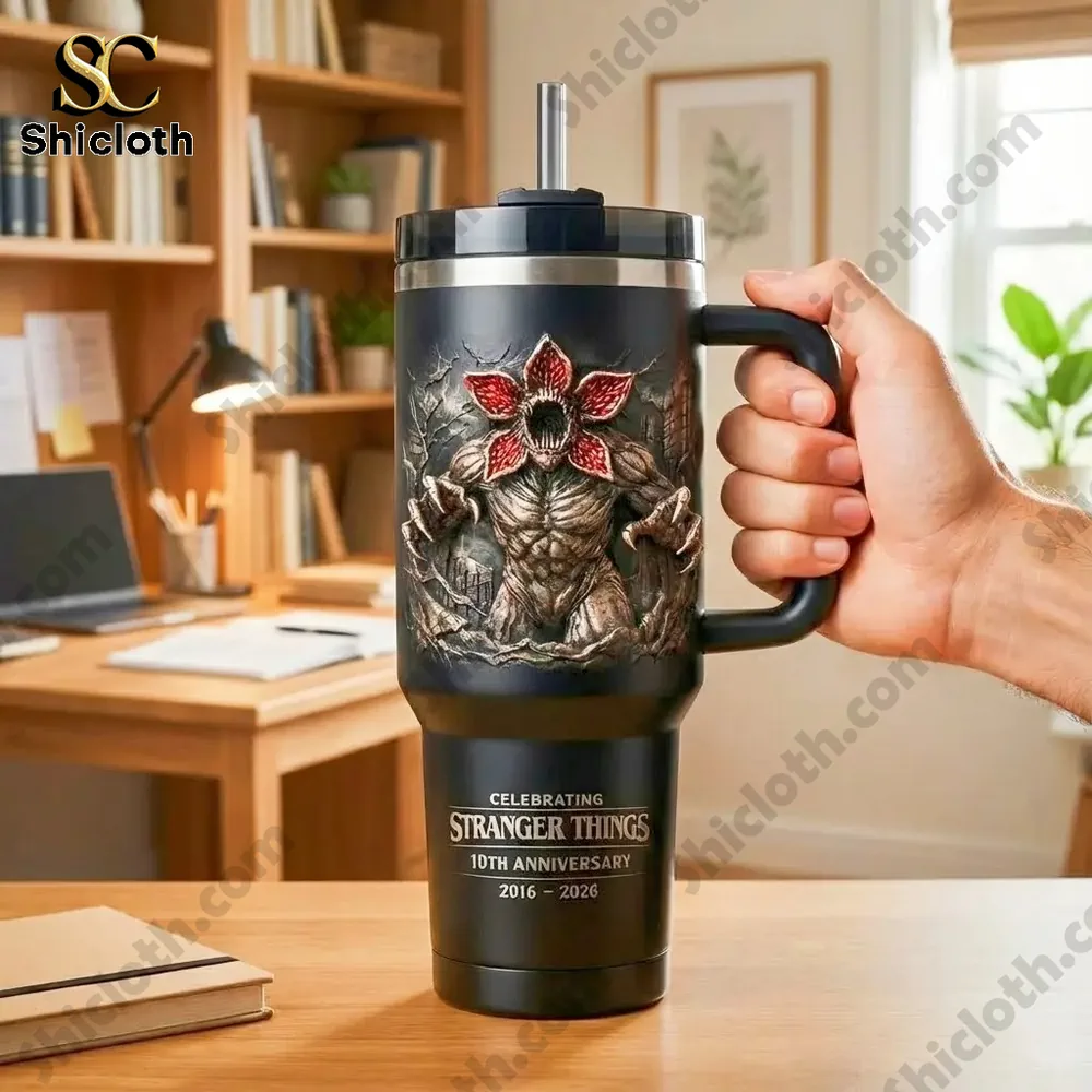Stranger Things themed insulated tumbler with demogorgon design on a desk!