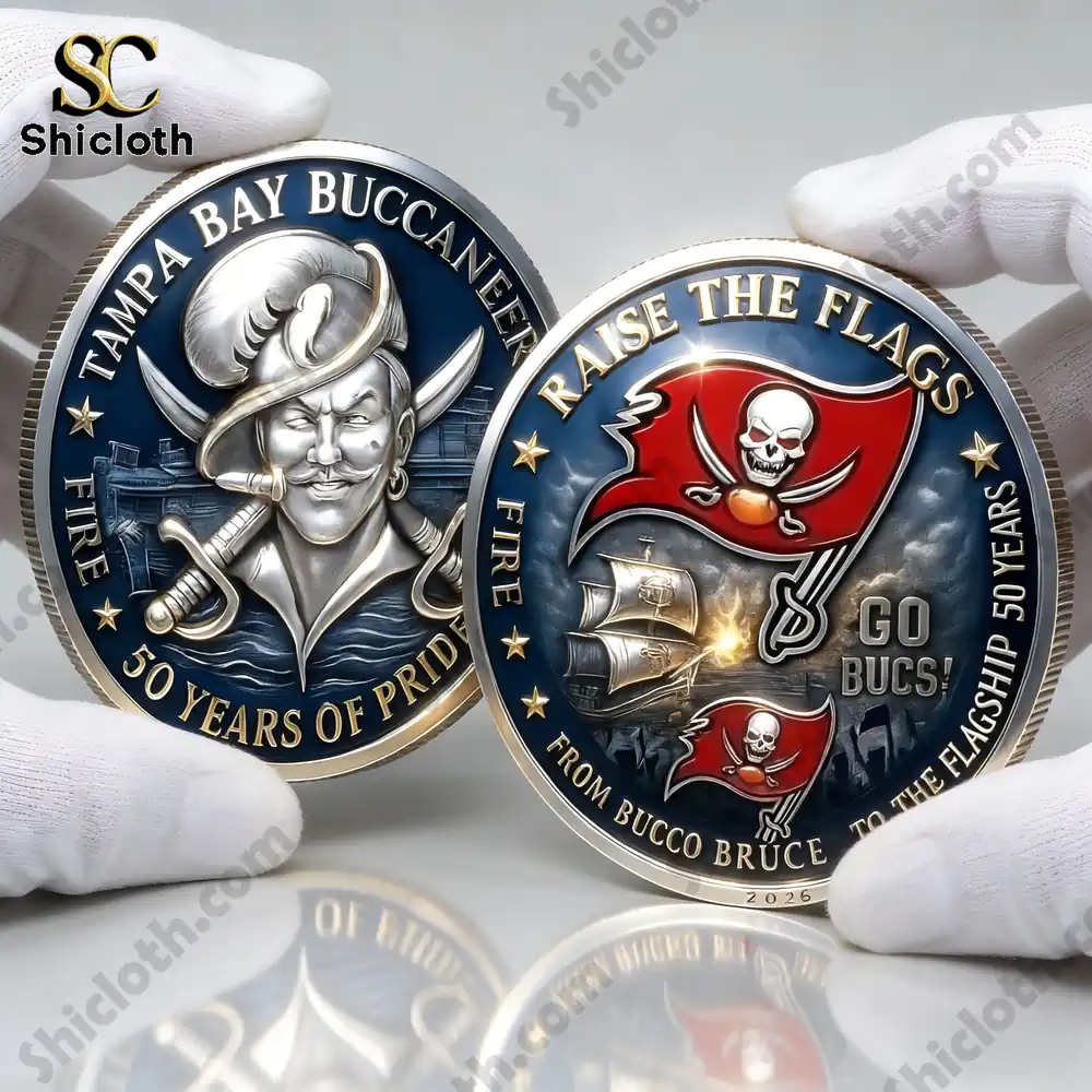 Two Buccaneers commemorative coins held by gloved hands!