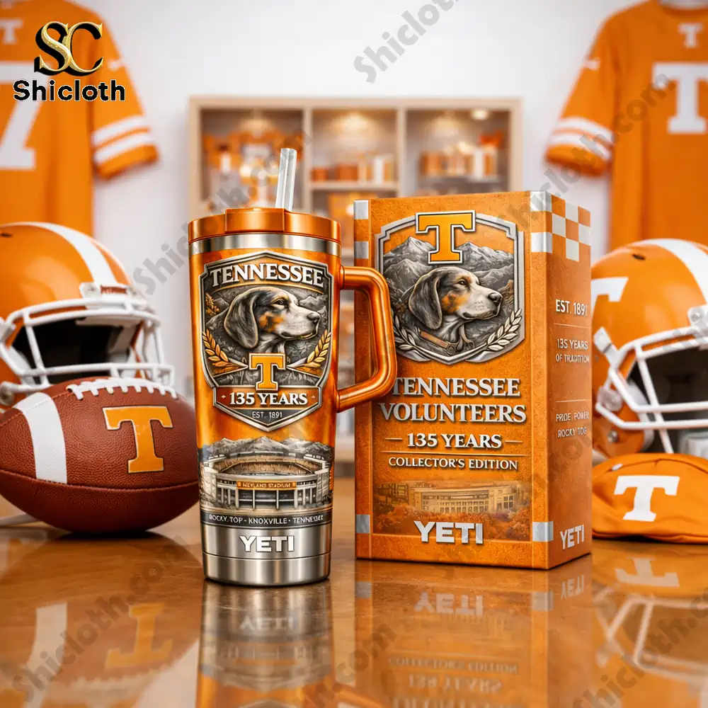 Orange Tennessee Volunteers YETI tumbler with collector box on sports themed table!