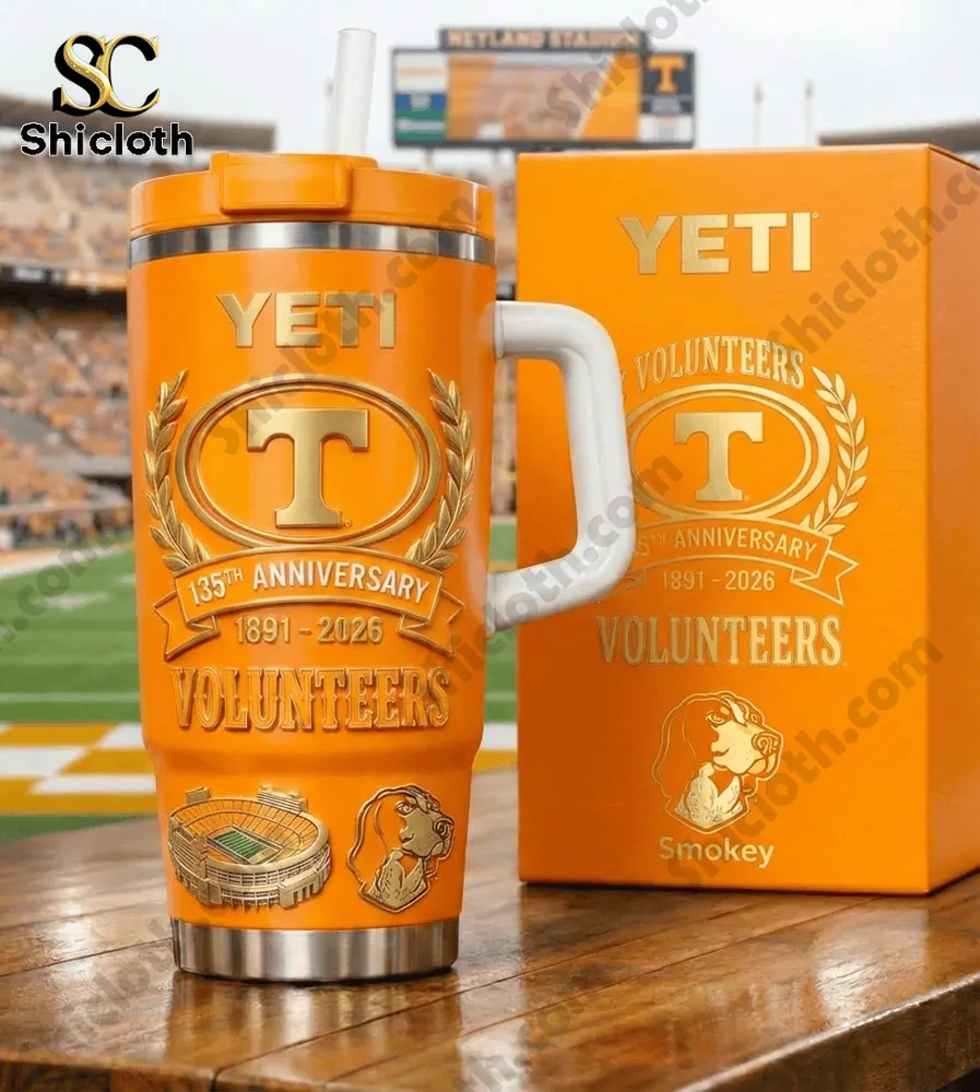 Orange YETI tumbler with Tennessee Volunteers logo at a football stadium!