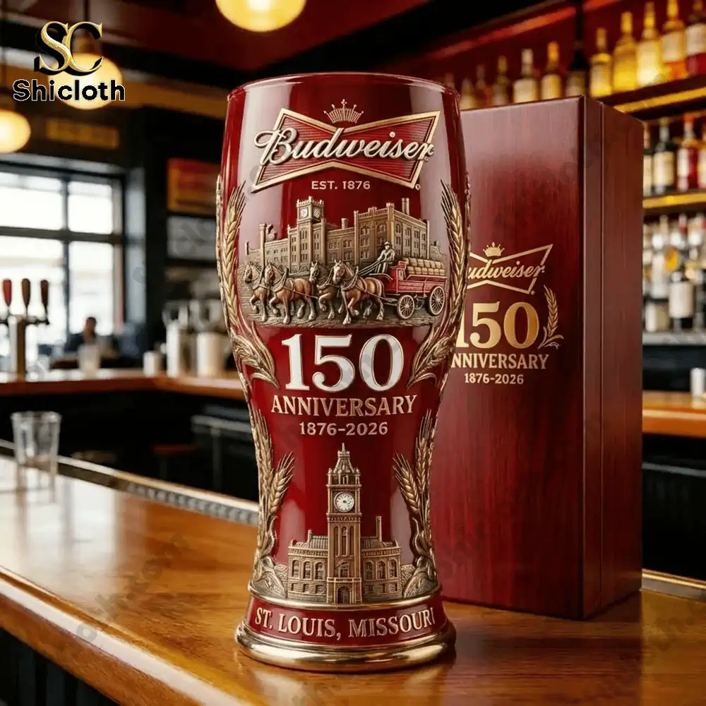 Close up of a red Budweiser anniversary beer glass with wooden gift box on a bar counter!