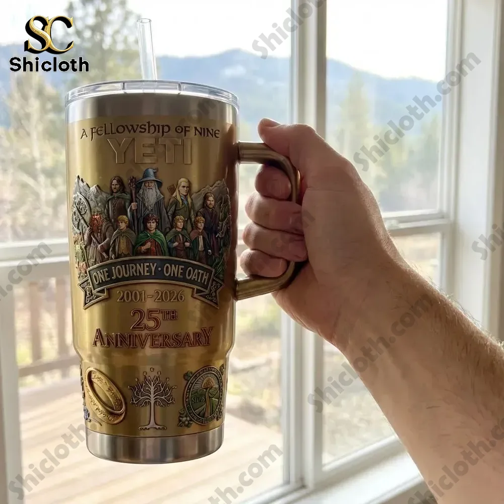 Hand holding Yeti Lord of the Rings anniversary travel mug near window!