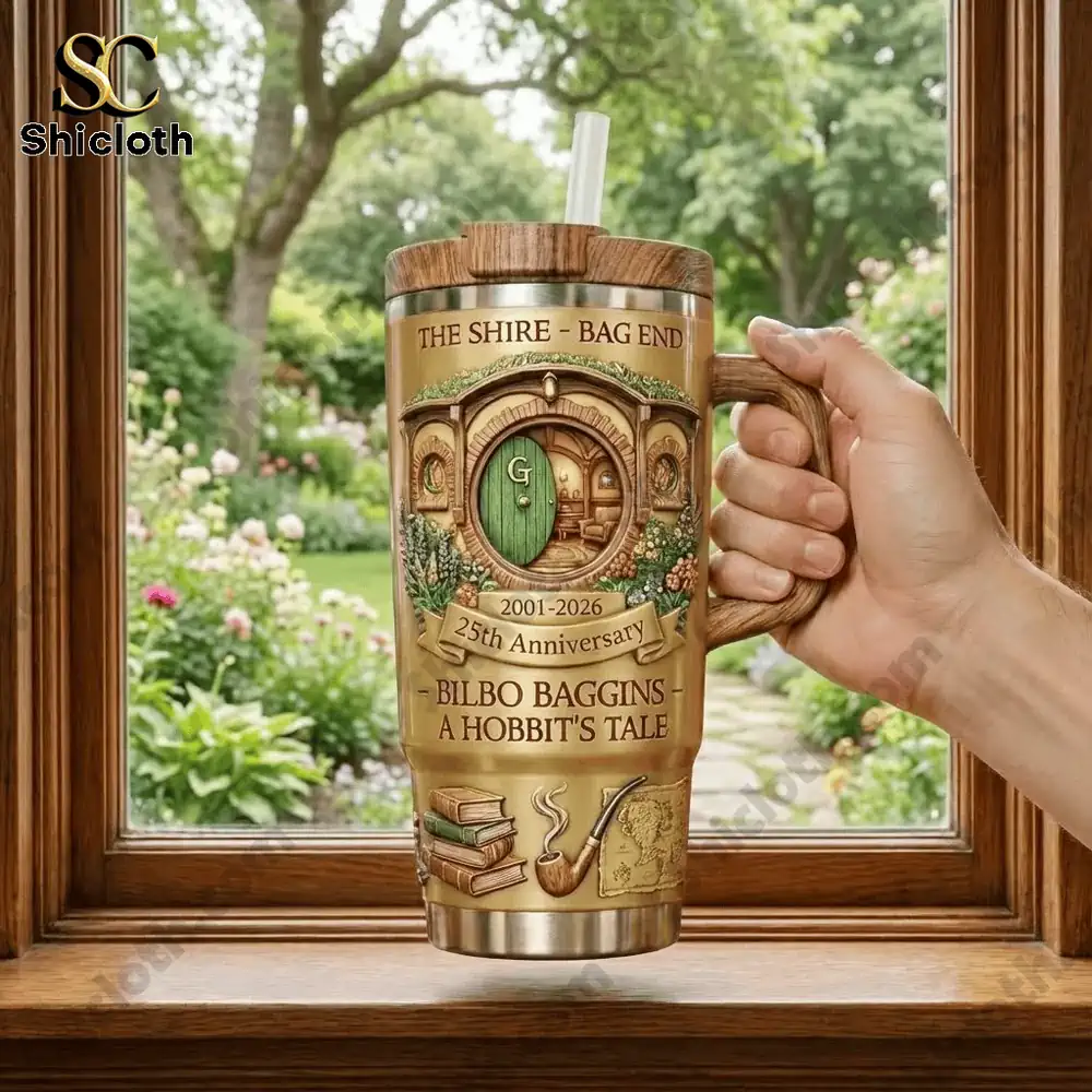 Hand holding Hobbit themed insulated mug by a garden window!