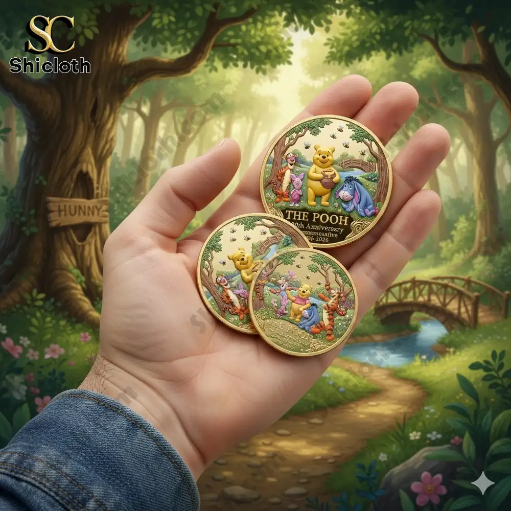 Hand holding Pooh commemorative coins in a forest scene!