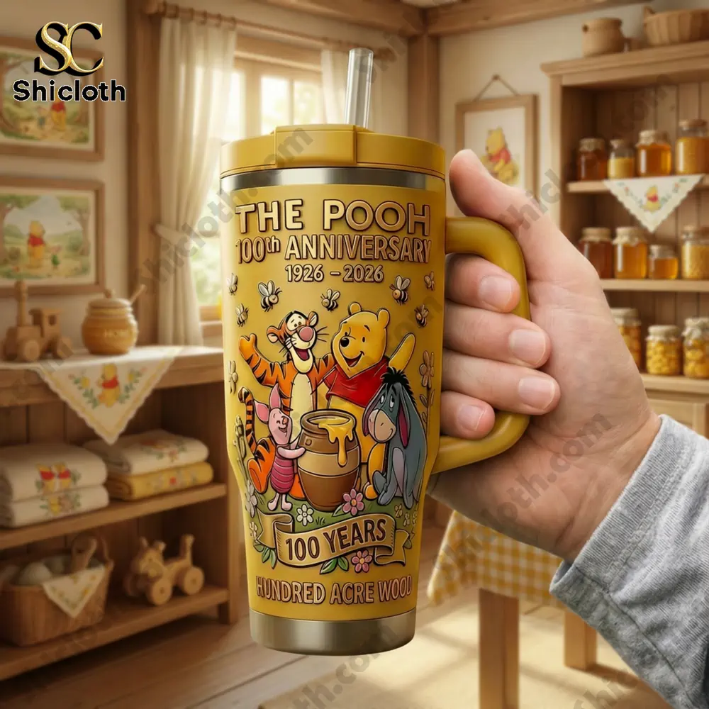 Hand holding Pooh anniversary mug in warm room!