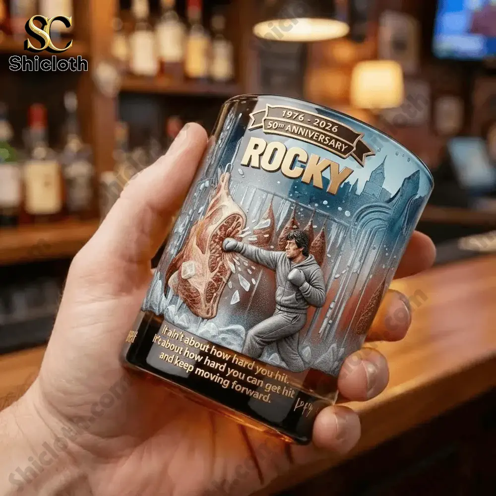 The Rocky Balboa 50th Anniversary Glass 3 Hand holding a Rocky themed whiskey glass at a bar!