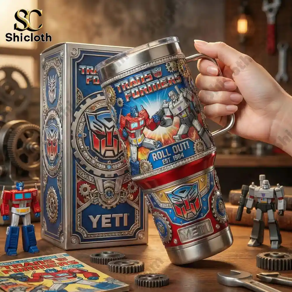 Transformers Optimus Prime And Megatron Tumbler With Handle 3 Hand holding Transformers Yeti cup surrounded by robot figures!