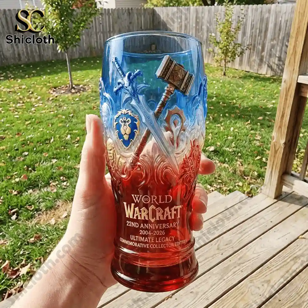 Hand holding World Warcraft commemorative glass outdoors!