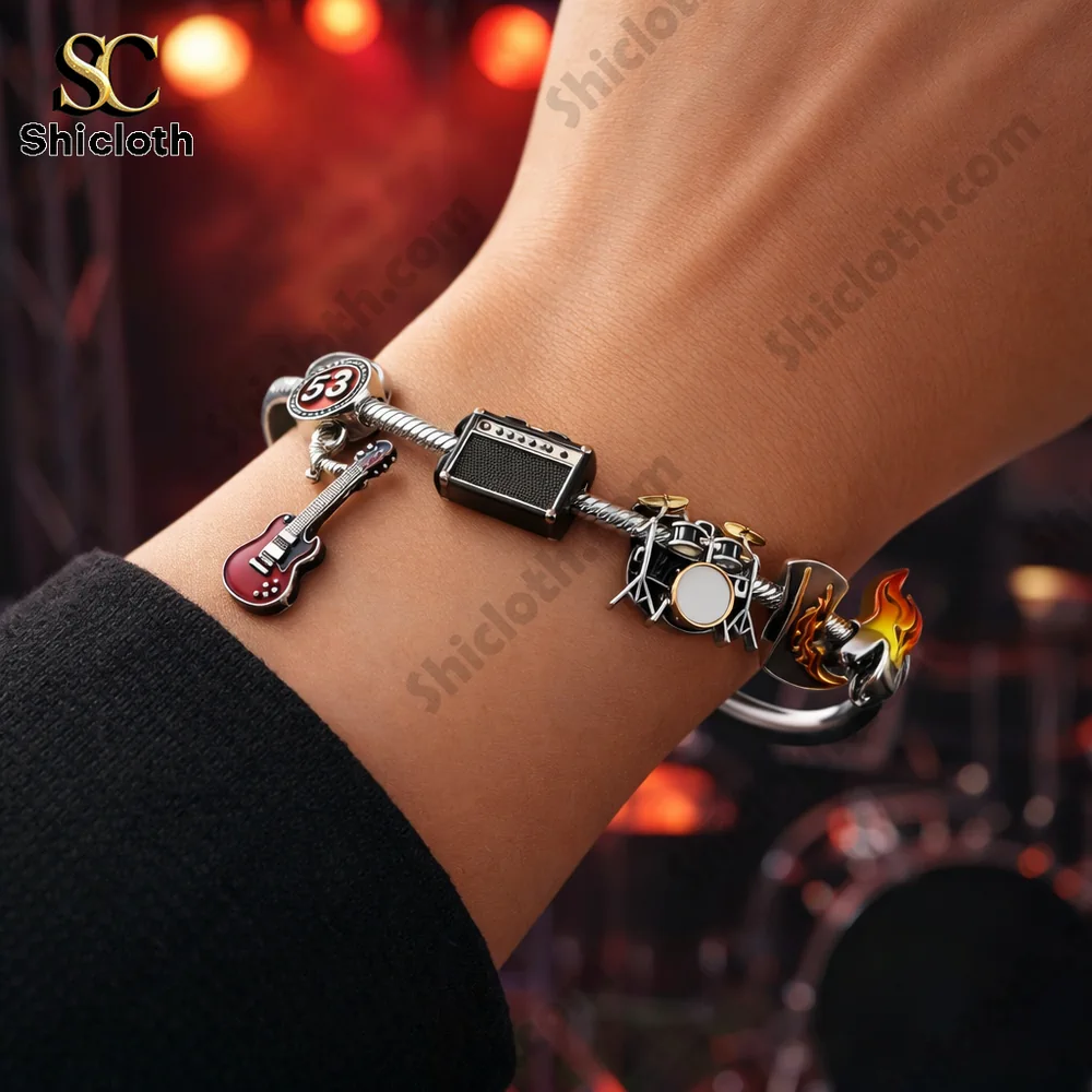 AC DC music themed charm bracelet worn on a wrist!