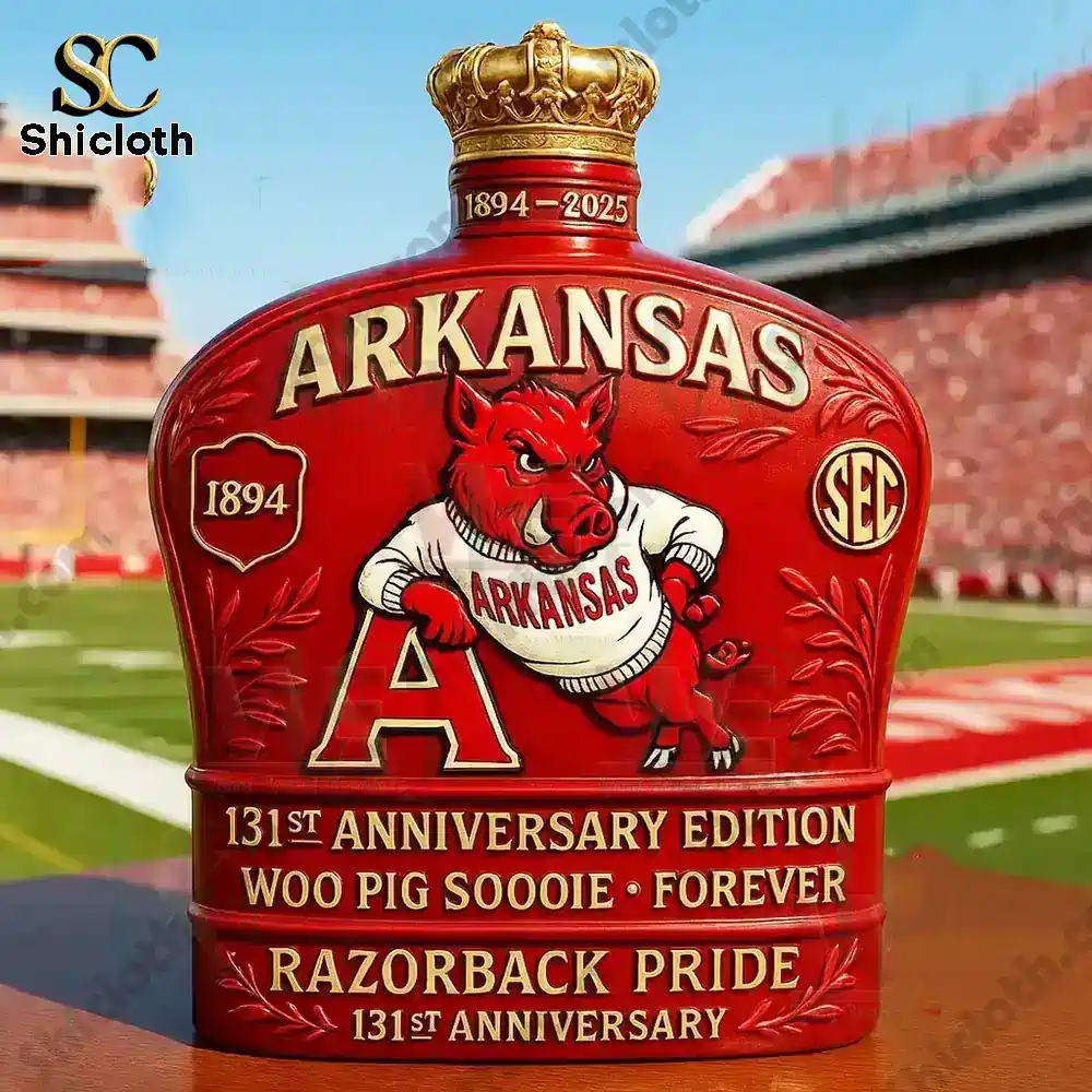 Red Arkansas Razorbacks anniversary bottle with crowned top and hog mascot design.