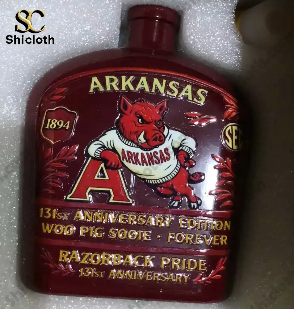 Arkansas Razorbacks 131st Anniversary Crown Royal Whiskey Bottle 3 Dark red Arkansas Razorbacks anniversary bottle inside foam packaging.