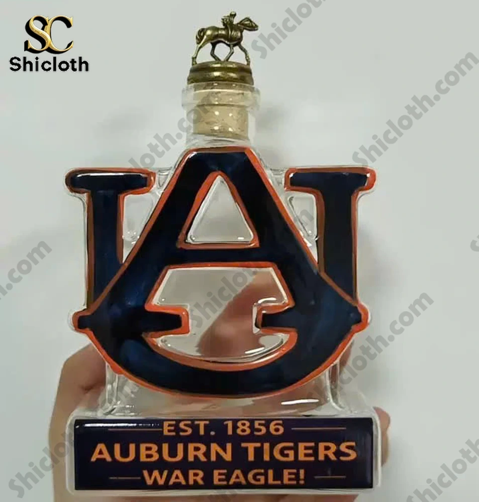 Clear Auburn Tigers AU logo liquor bottle with horse rider stopper