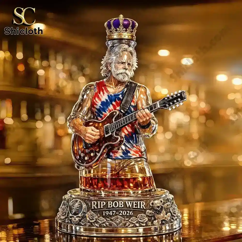 Bob Weir tribute whiskey bottle figure holding guitar with RIP 1947 2026 base on bar counter!