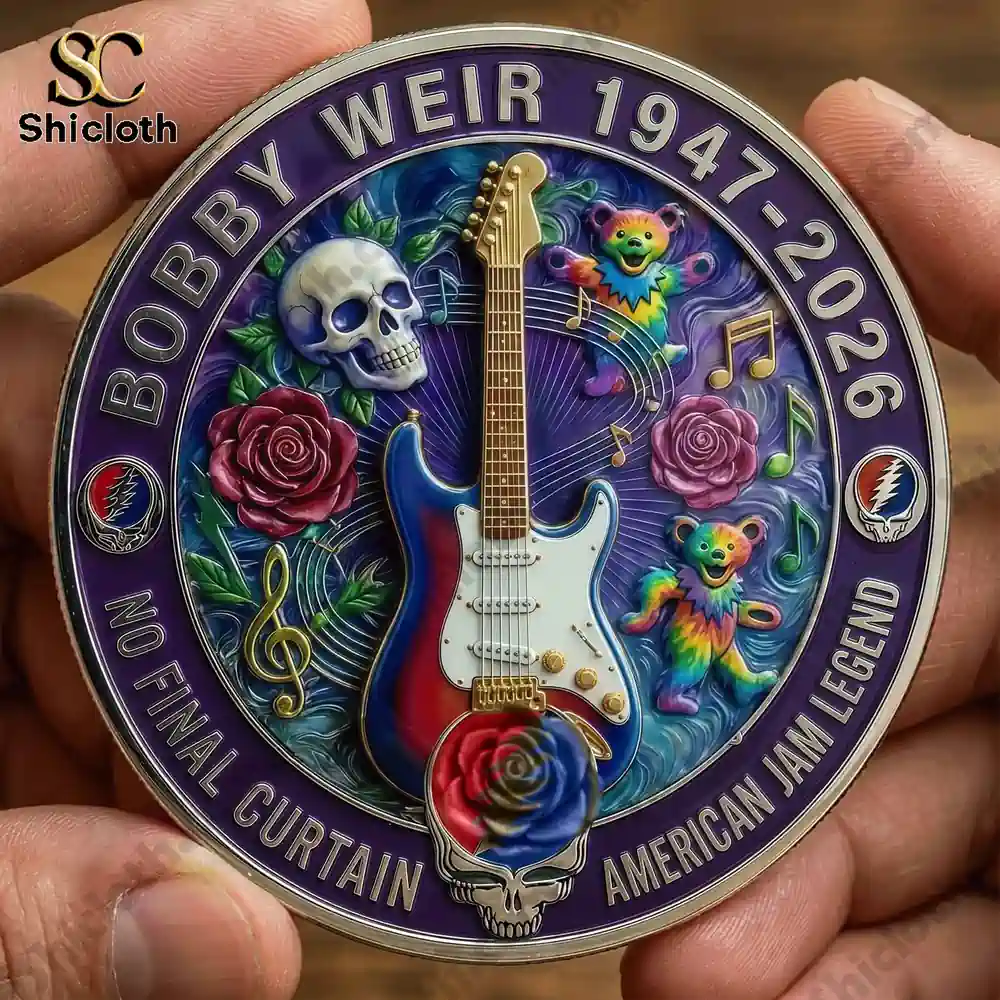 Hand holding Bobby Weir memorial coin featuring electric guitar roses skull and colorful bears.