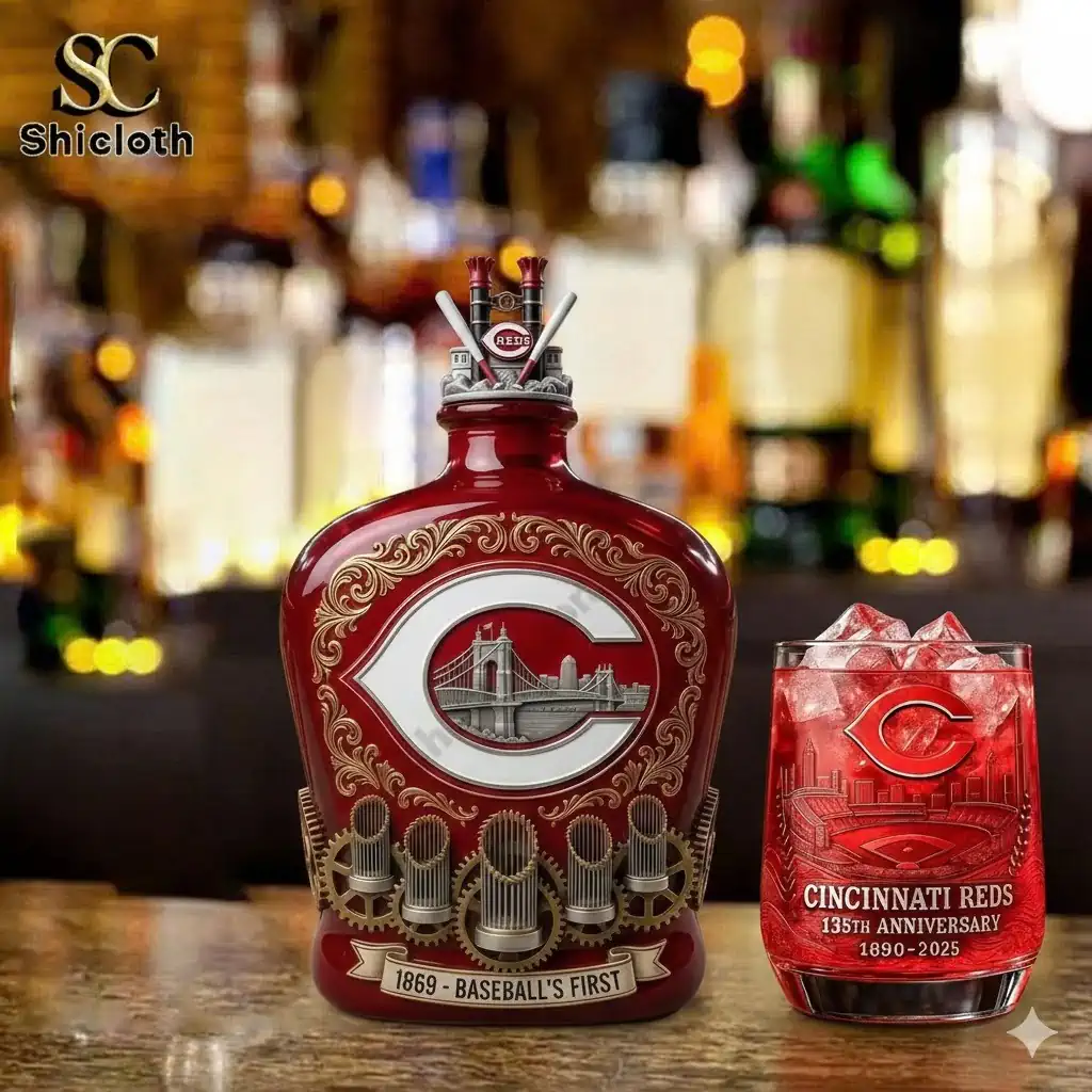 Cincinnati Reds anniversary whiskey bottle and red engraved glass on a bar counter!