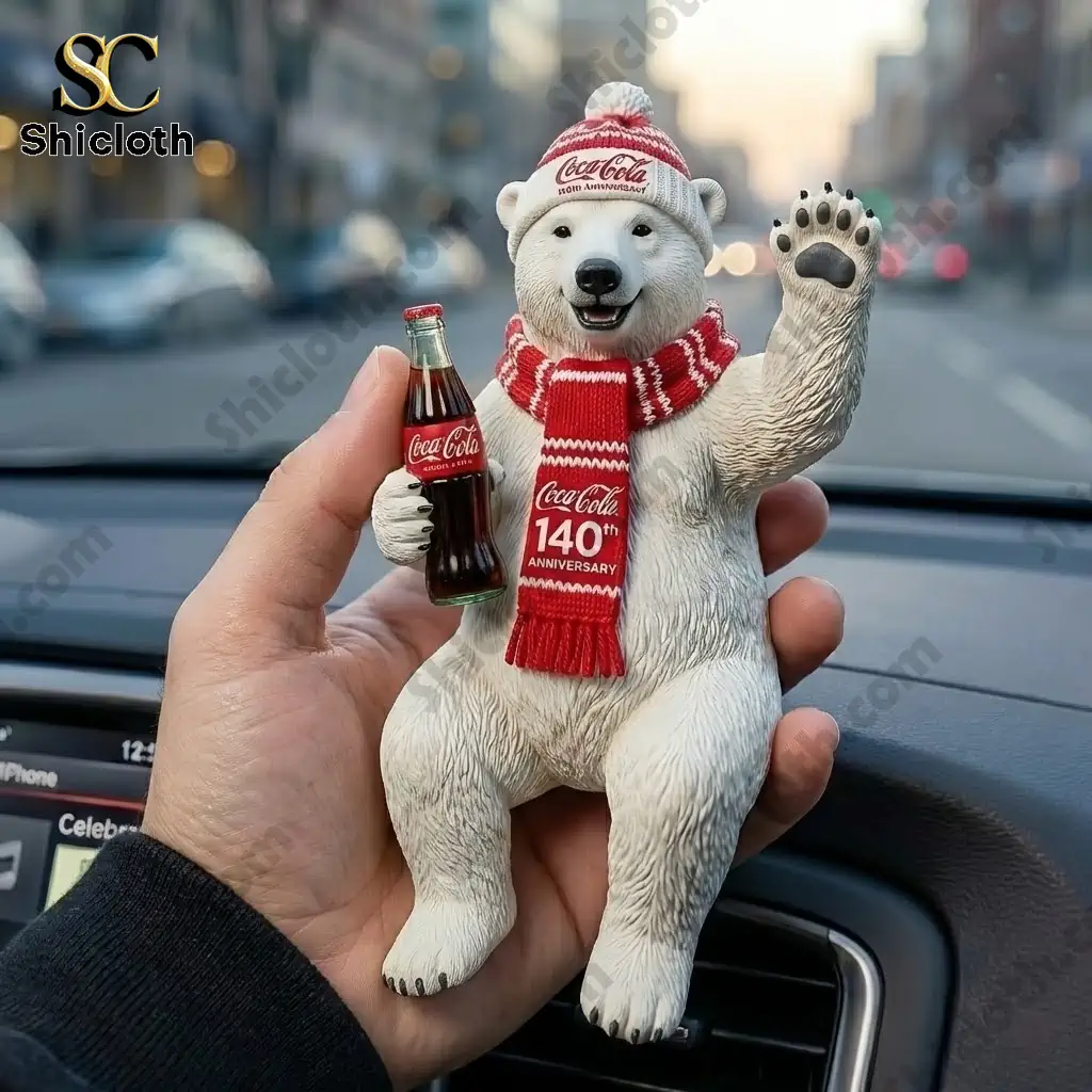 Polar bear Coca Cola 140th Anniversary figure held in hand inside a car