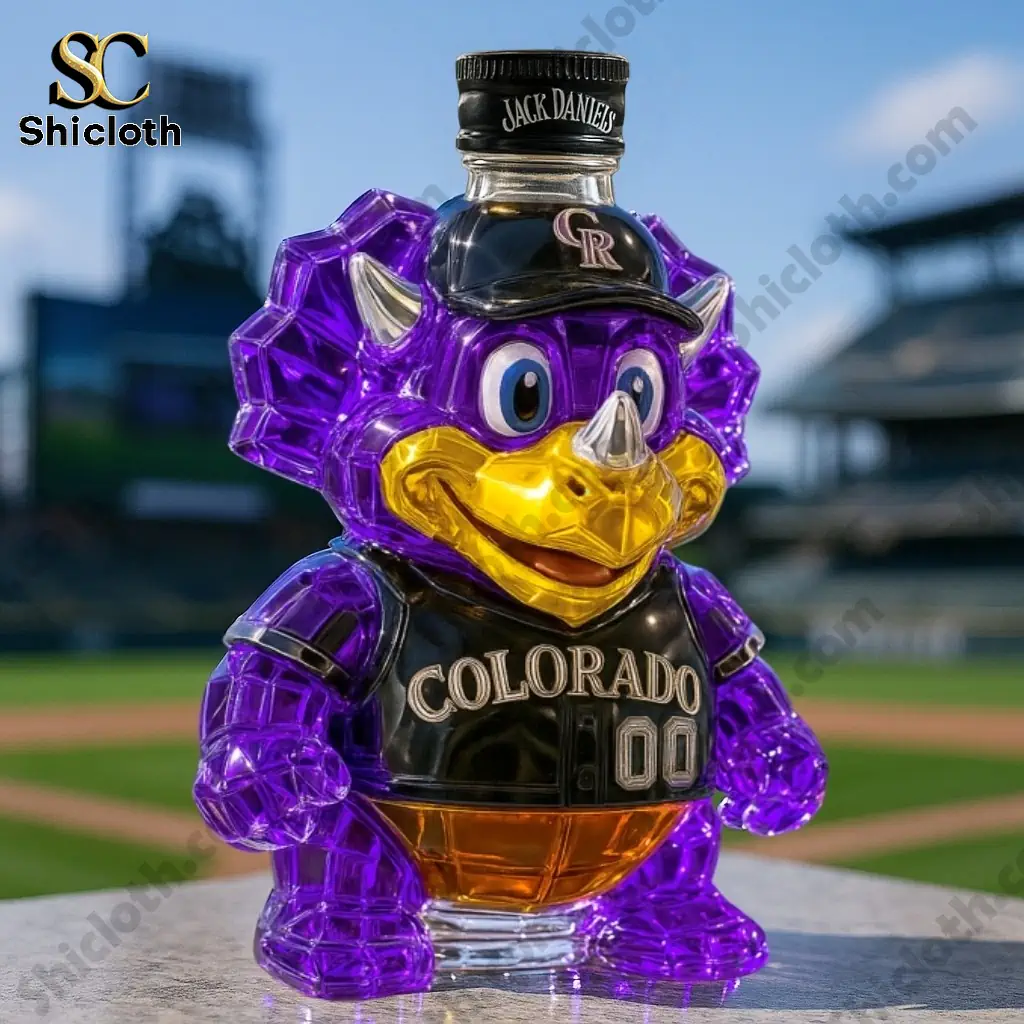 Colorado Rockies Whiskey Bottle 6 Purple Colorado Rockies dinosaur whiskey bottle with a Jack Daniels cap on top.