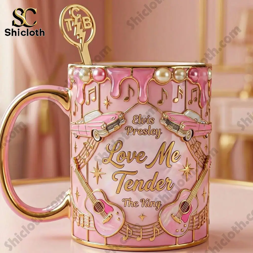 Close up of a pink Elvis Presley Love Me Tender mug with gold handle and music design.