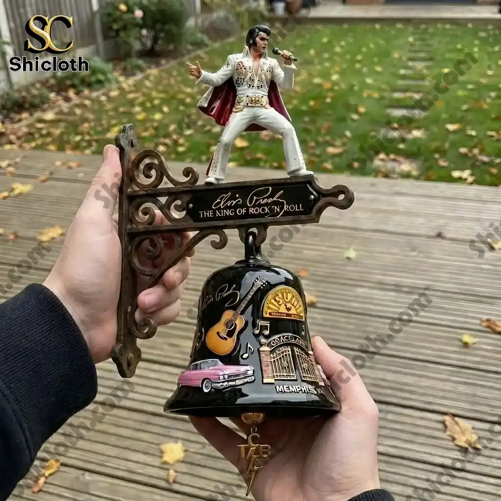 Hand holding Elvis Presley King of Rock and Roll wall bell outdoors!