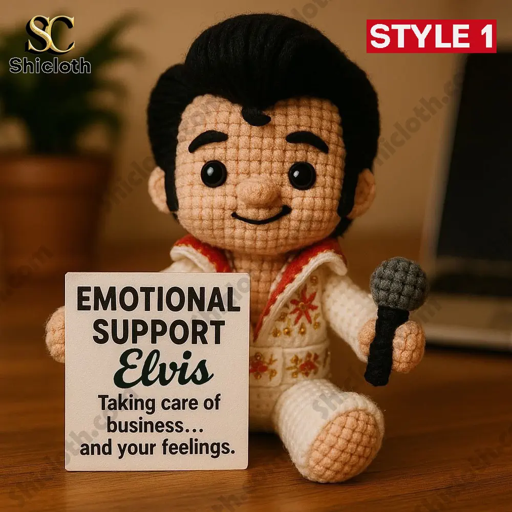 Crochet singer doll holding a microphone beside an emotional support sign!